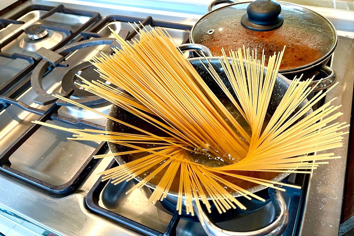 Spaghetti in a pot on a stove (Getty Images/Mansoreh Motamedi)
