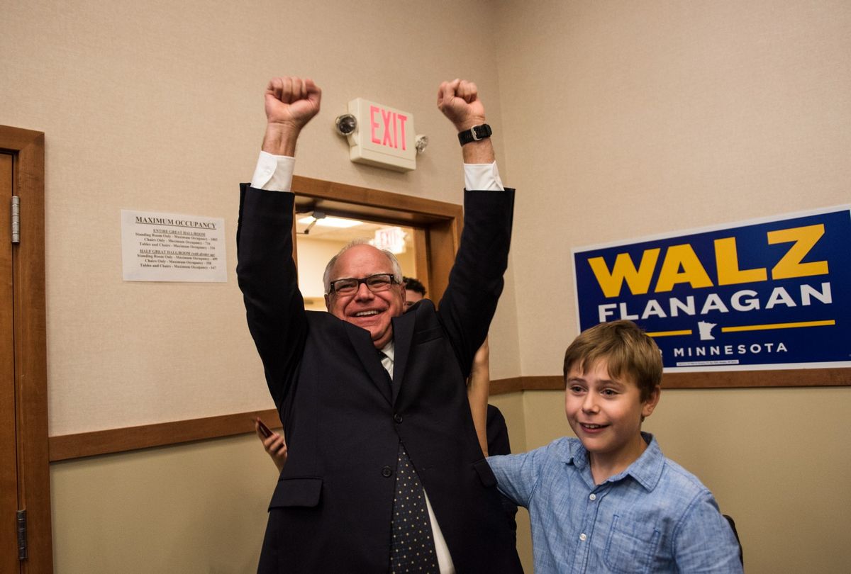 Tim Walz (D-MN) and his son Gus Walz celebrate while entering his election night party. (Stephen Maturen/Getty Images)