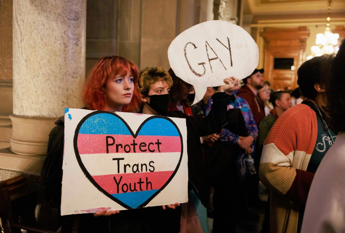 Protesters inside the Indiana Statehouse as the Indiana Senate's Health and Provider Services Committee considers SB480, which would ban gender transition procedures for minors in Indiana. (Jeremy Hogan/SOPA Images/LightRocket via Getty Images)