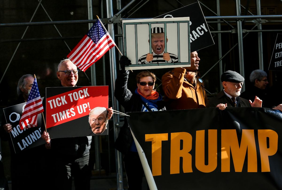 Protesters gather outside Manhattan Criminal Court as a grand jury is expected to vote this week on whether to indict former President Donald Trump on March 21, 2023 in New York City.  (Pablo Monsalve/VIEWpress via Getty Images)