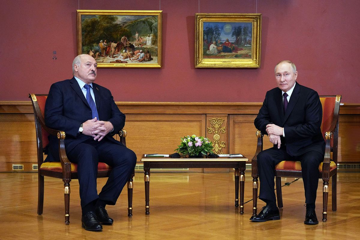 Russia's President Vladimir Putin (R) speaks with his Belarus counterpart Alexander Lukashenko (L) during their meeting on the sidelines of an informal summit of the heads of state of the Commonwealth of Independent States (CIS) at the State Russian Museum in Saint Petersburg on December 27, 2022. (ALEXEY DANICHEV/SPUTNIK/AFP via Getty Images)
