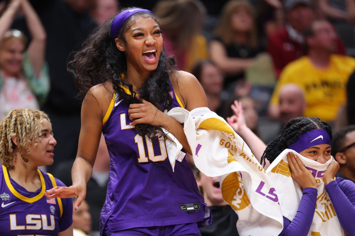 Angel Reese, #10 of the Louisiana State Tigers, smiles from the bench as her team scores against the Iowa Hawkeyes during the 2023 NCAA Women's Basketball Tournament National Championship on April 2, 2023 in Dallas, Texas. (C. Morgan Engel/NCAA Photos via Getty Images)