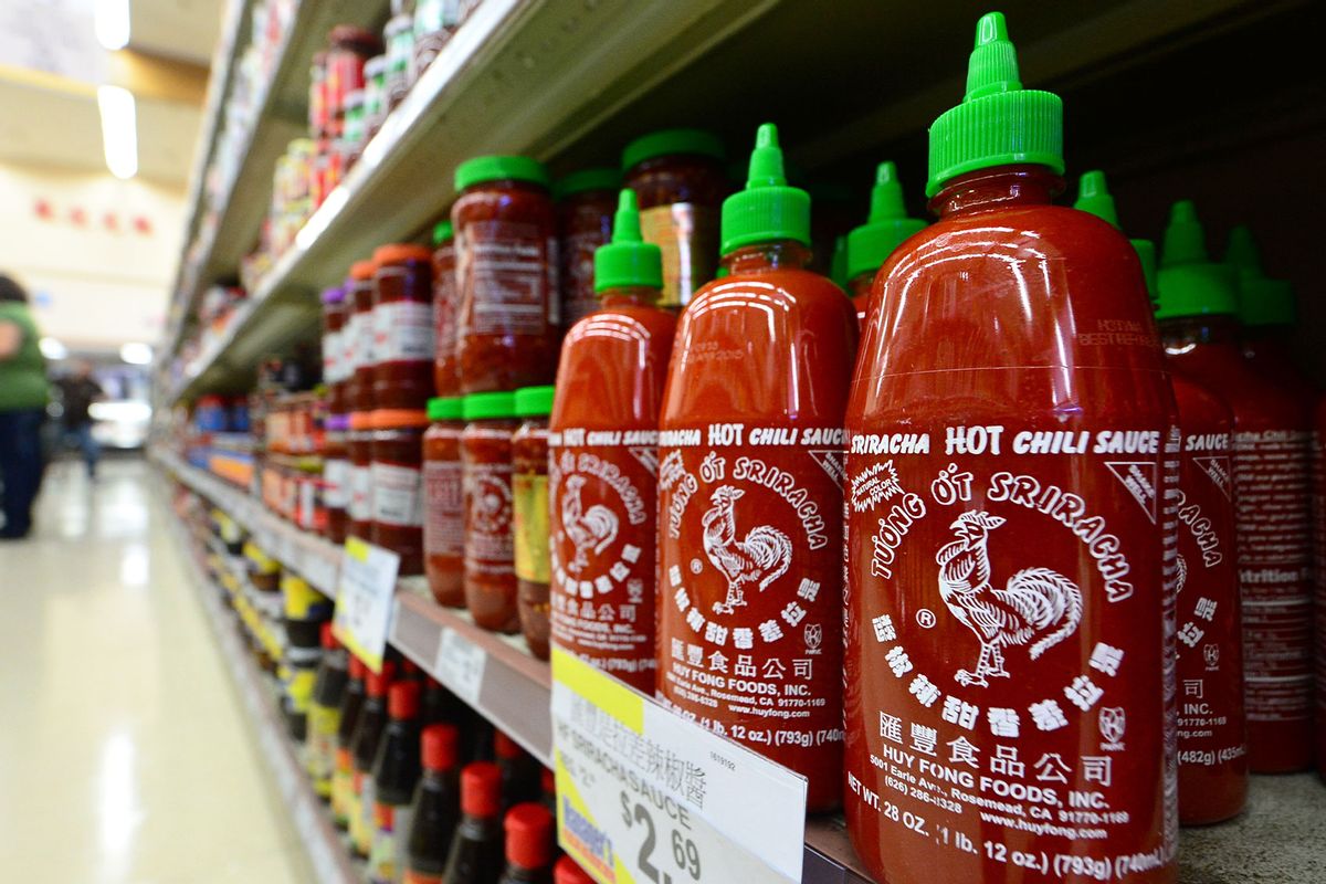 Bottles of Sriracha chili sauce are displayed on shelves inside a supermarket (FREDERIC J. BROWN/AFP via Getty Images)