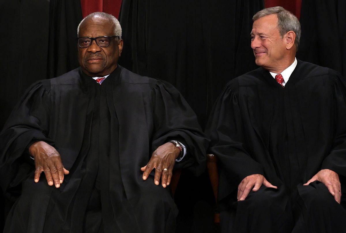 United States Supreme Court Associate Justice Clarence Thomas (L) and Chief Justice of the United States John Roberts (R) on October 7, 2022 in Washington, DC.  (Alex Wong/Getty Images)