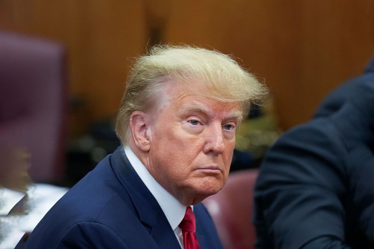 Former U.S. President Donald Trump sits at the defense table with his defense team in a Manhattan court on April 4, 2023 in New York City. (Seth Wenig-Pool/Getty Images)
