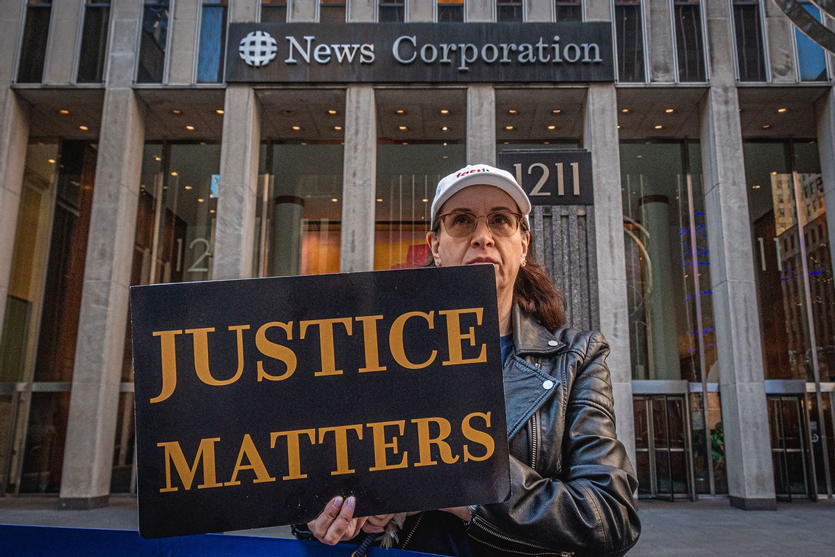 Participant seen holding a sign at the protest. On Election Day 2022, members of the activist groups Truth Tuesdays and Rise and Resist gathered at the weekly FOX LIES DEMOCRACY DIES event outside the NewsCorp Building at 1211 6th Ave. (Erik McGregor/LightRocket via Getty Images)