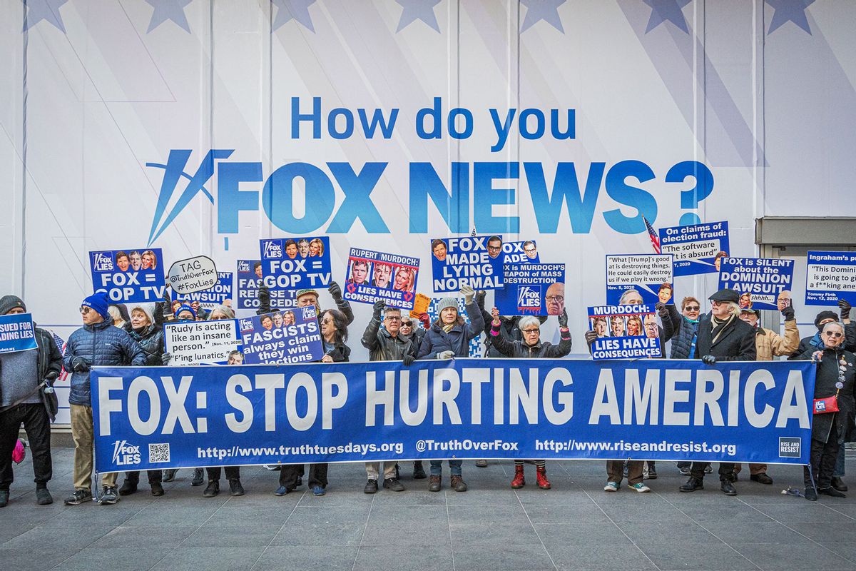 Participants seen holding a banner outside Fox News HQ. (Erik McGregor/LightRocket via Getty Images)