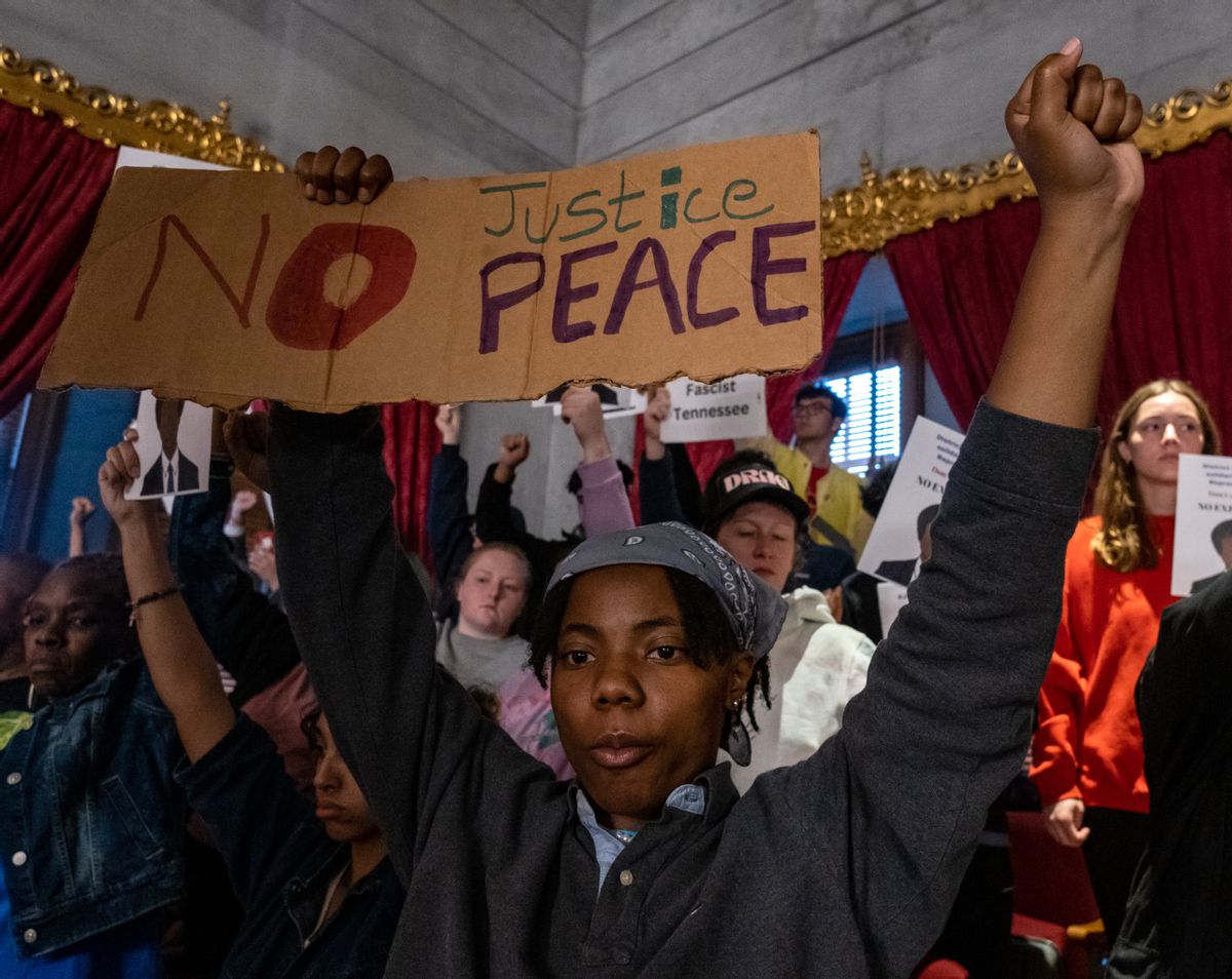 Protesters calling for gun reform laws and showing support for the Democratic representatives facing expulsion stand in the House gallery at the Tennessee State Capitol building on April 6, 2023 in Nashville. (Seth Herald/Getty Images)