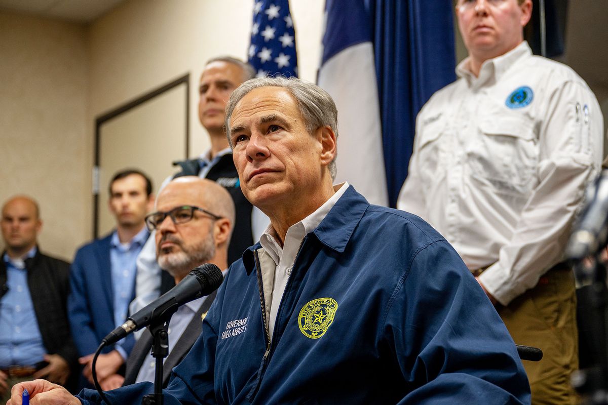 Texas Gov. Greg Abbott and state officials listen to reporters during a news conference on January 31, 2023 in Austin, Texas. (Brandon Bell/Getty Images)