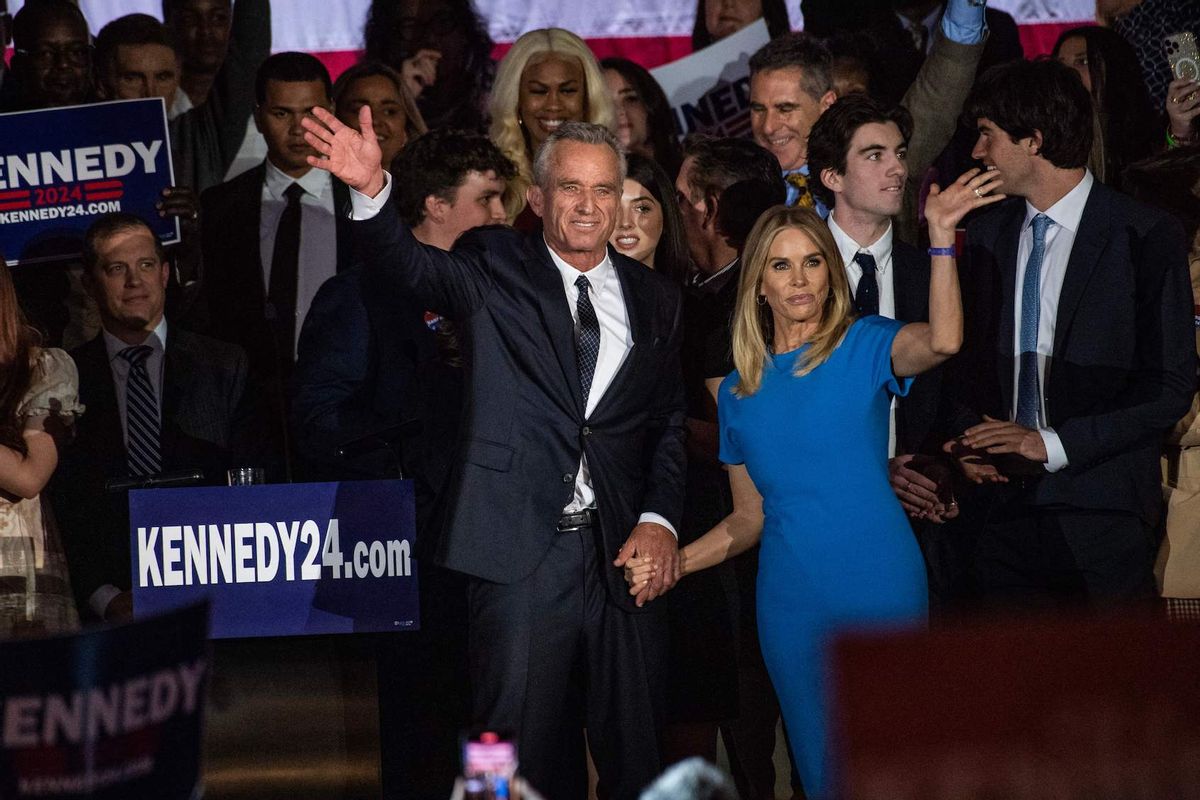 Robert F Kennedy Jr., with his wife Cheryl Hines, waves to supporters during a campaign event to launch his 2024 presidential bid, at the Boston Park Plaza in Boston, Massachusetts, on April 19, 2023. (JOSEPH PREZIOSO/AFP via Getty Images)