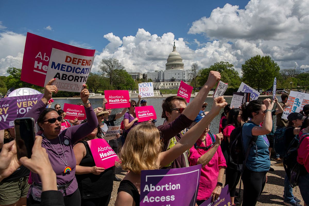 Activists hold abortion rights signs and shout slogans while joining in a rally. Abortion rights activists rallied outside the US Supreme Court in Washington, DC. (Probal Rashid/LightRocket via Getty Images)