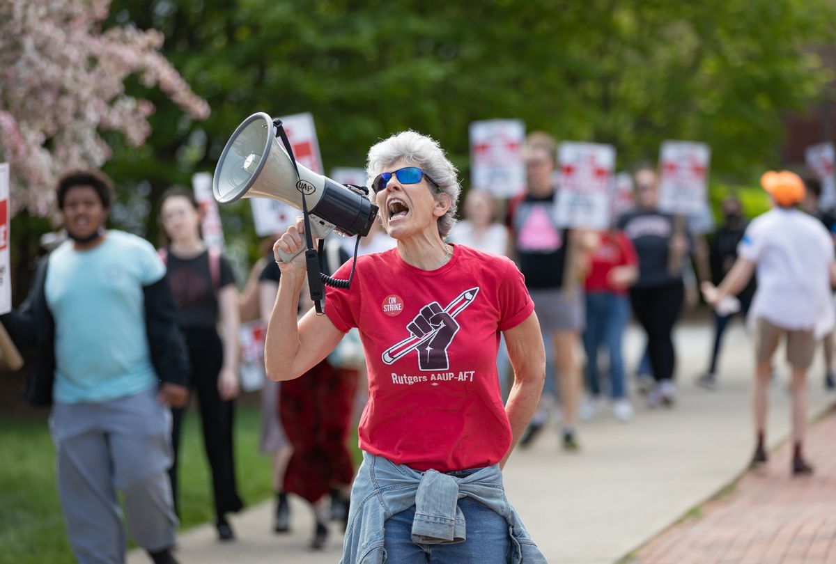 A protester with a bullhorn leads chants with Rutgers students and faculty as they participate in a strike at the university's main campus in New Brunswick.  (Michael Nigro/Pacific Press/LightRocket via Getty Images)