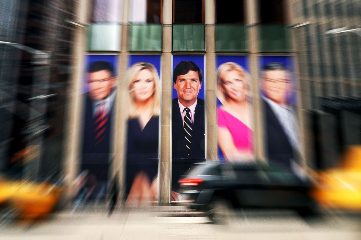 Traffic on Sixth Avenue passes by advertisements featuring Fox News personalities, focussing on Tucker Carlson, adorn the front of the News Corporation building, March 13, 2019 in New York City. (Photo illustration by Salon/Drew Angerer/Getty Images)