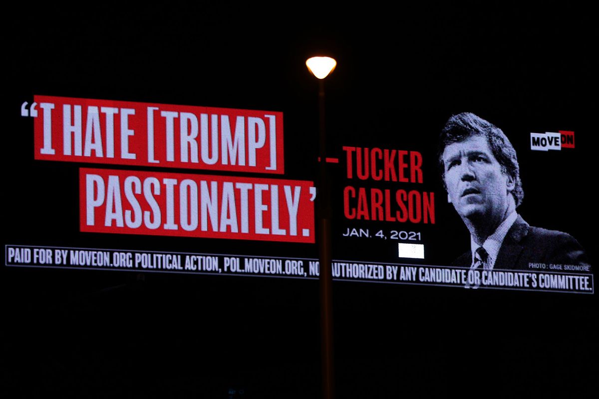 A billboard put up by progressive activist group MoveOn that read “I Hate [Trump] Passionately - Tucker Carlson” is seen along I-95 on April 3, 2023 in West Palm Beach, Florida. (Alex Wong/Getty Images)