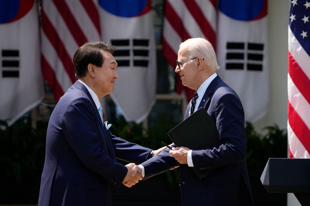 U.S. President Joe Biden (R) and South Korean President Yoon Suk-yeol shake hands during a joint press conference in the Rose Garden at the White House, April 26, 2023 in Washington, DC. (Drew Angerer/Getty Images)
