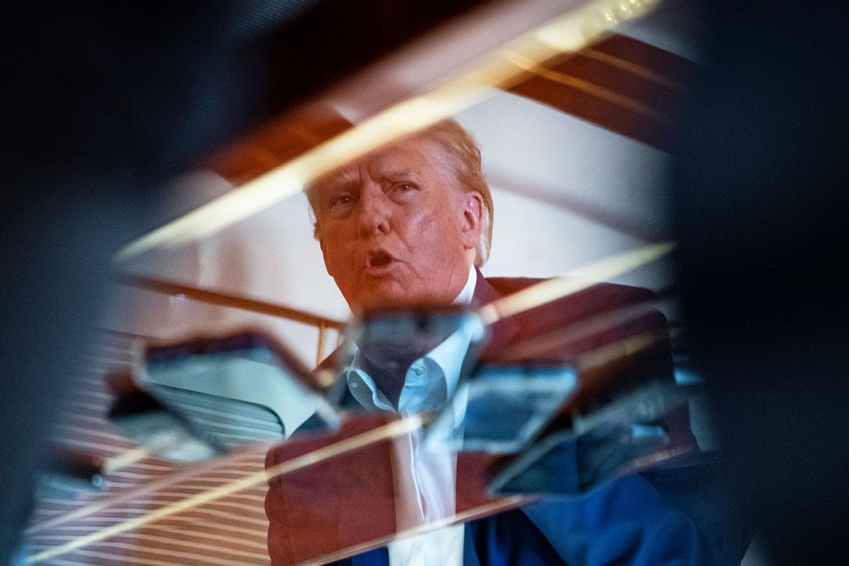 Former President Donald Trump speaks with reporters and staff on his airplane, known as Trump Force One, as he is flown to Iowa on Monday, March 13, 2023, in West Palm Beach, FL. (Jabin Botsford/The Washington Post via Getty Images)