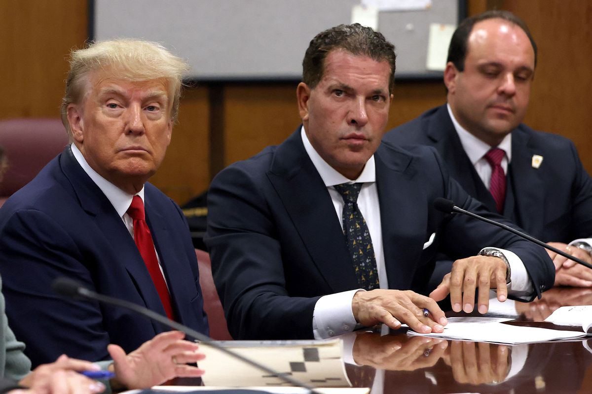 Former U.S. President Donald Trump sits with his attorneys Joe Tacopina and Boris Epshteyn inside the courtroom during his arraignment at the Manhattan Criminal Court April 4, 2023 in New York City. (Andrew Kelly-Pool/Getty Images)