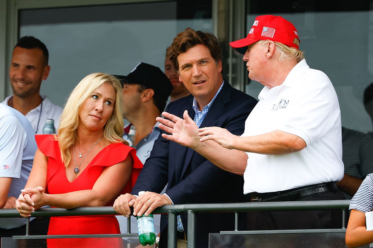 Former President Donald Trump, Tucker Carlson and Marjorie Taylor Greene during the 3rd round of the LIV Golf Invitational Series Bedminster on July 31, 2022 at Trump National Golf Club in Bedminster, New Jersey. (Rich Graessle/Icon Sportswire via Getty Images)