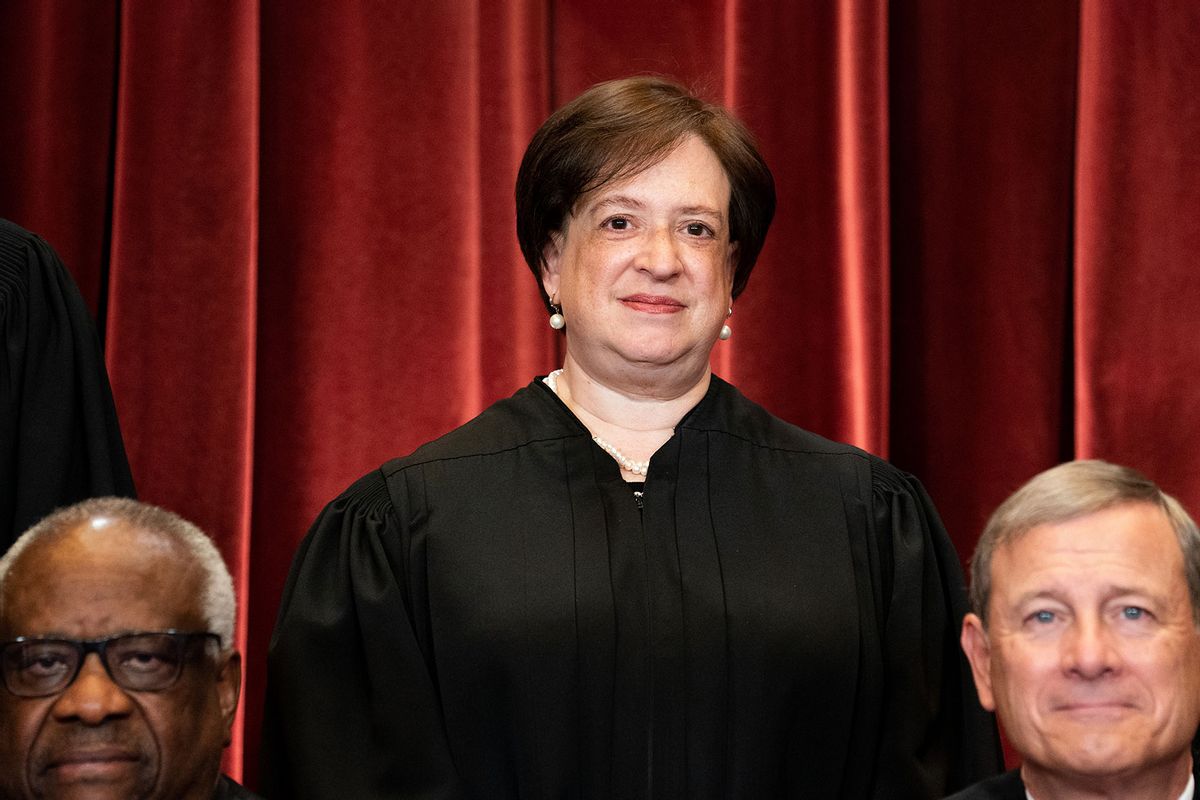 Associate Justice Elena Kagan, with Associate Justice Clarence Thomas and Chief Justice John Roberts in front of her, stands during a group photo of the Justices at the Supreme Court in Washington, DC on April 23, 2021. (Erin Schaff-Pool/Getty Images)