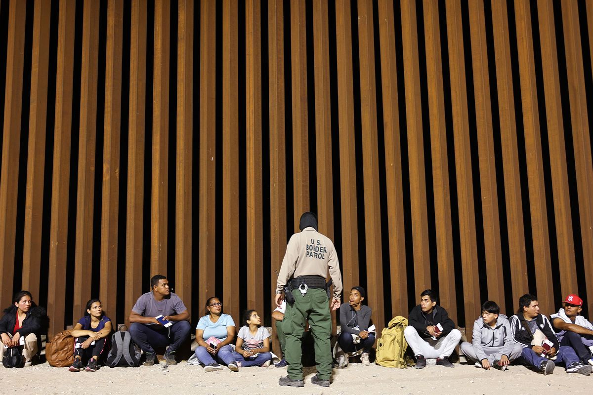Immigrants seeking asylum, who were apprehended at the time Title 42 expired are processed, by U.S. Border Patrol agents, after crossing into Arizona from Mexico, on May 11, 2023 in Yuma, Arizona. (Mario Tama/Getty Images)