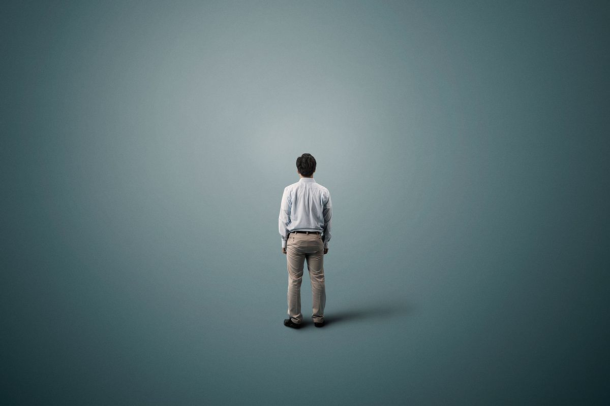 Man standing alone in space (Getty Images/Yagi Studio)