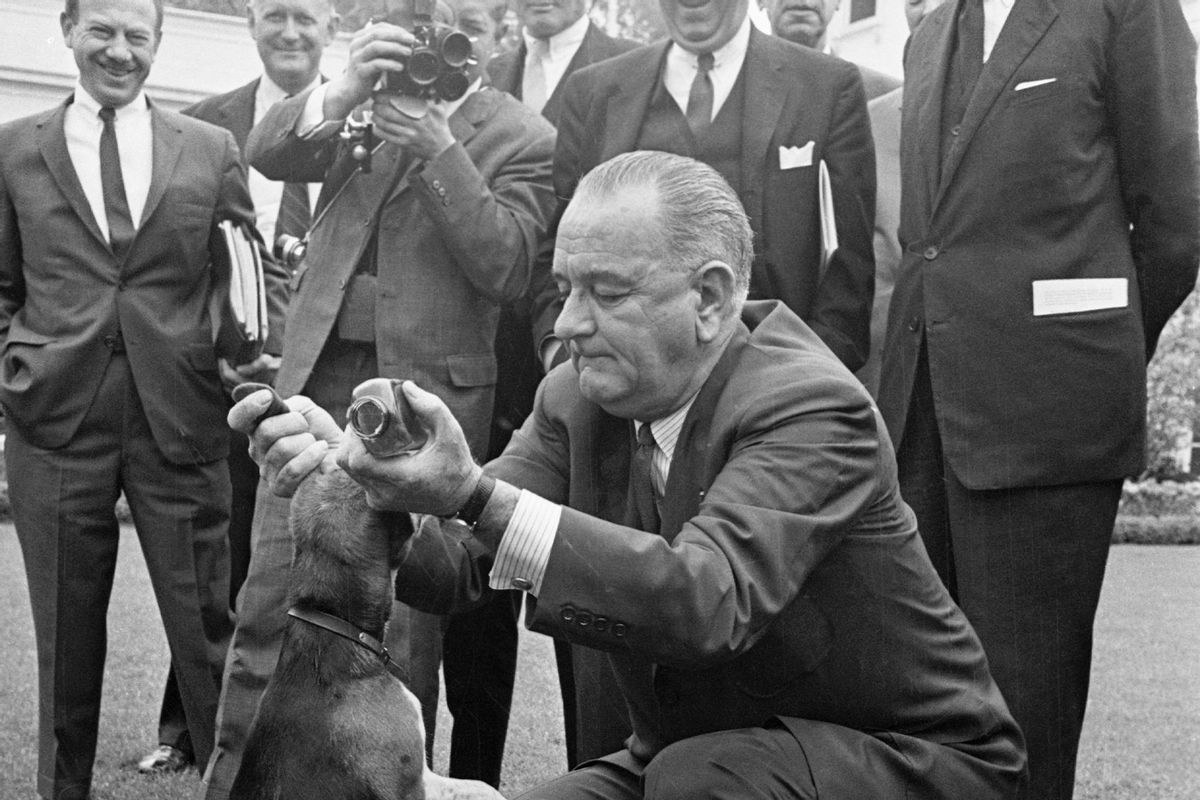 President Lyndon B Johnson Lifts Beagle by the Ears (Getty Images/Bettmann Contributor)