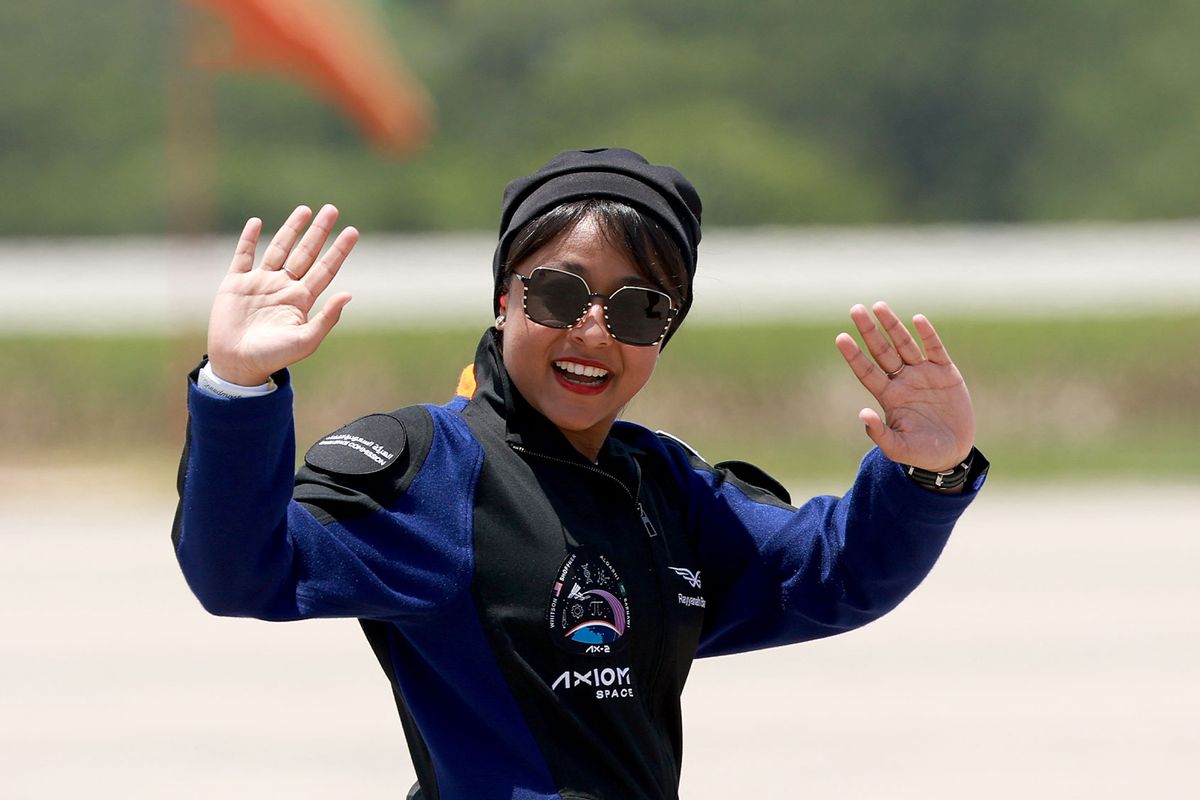 Saudi astronaut Rayyanah Barnawi waves before being brought to the SpaceX Falcon 9 rocket with the Crew Dragon spacecraft for launch from pad 39A at the Kennedy Space Center on May 21, 2023 in Cape Canaveral, Florida. (Joe Raedle/Getty Images)