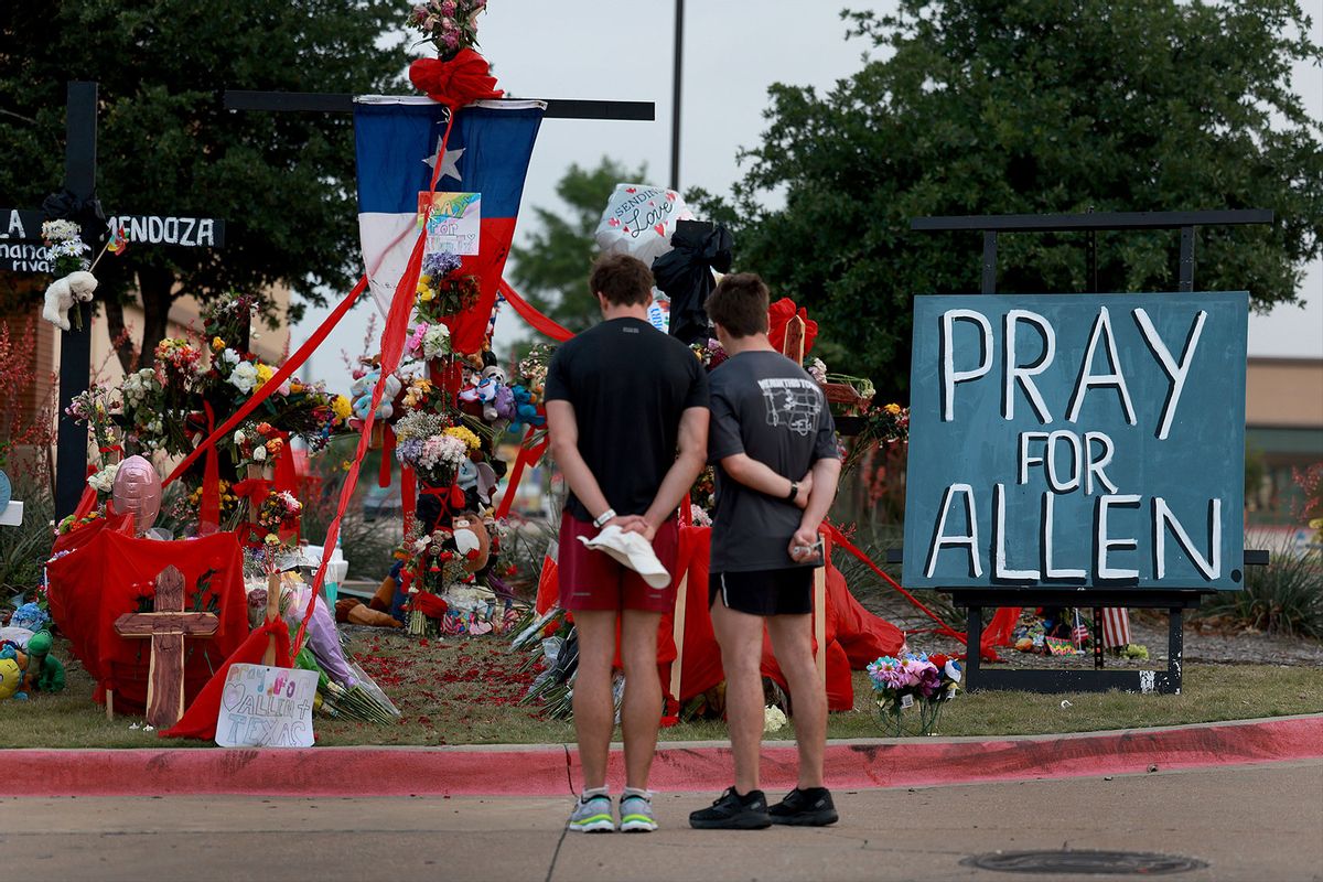 People visit the memorial setup near the scene of a mass shooting at the Allen Premium Outlets mall on May 9, 2023 in Allen, Texas. (Joe Raedle/Getty Images)