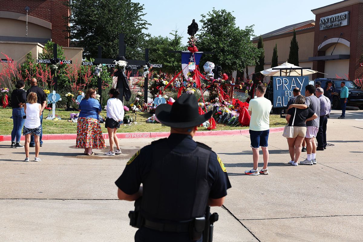 People visit the memorial set up near the scene of a mass shooting at the Allen Premium Outlets mall on May 9, 2023 in Allen, Texas. (Joe Raedle/Getty Images)