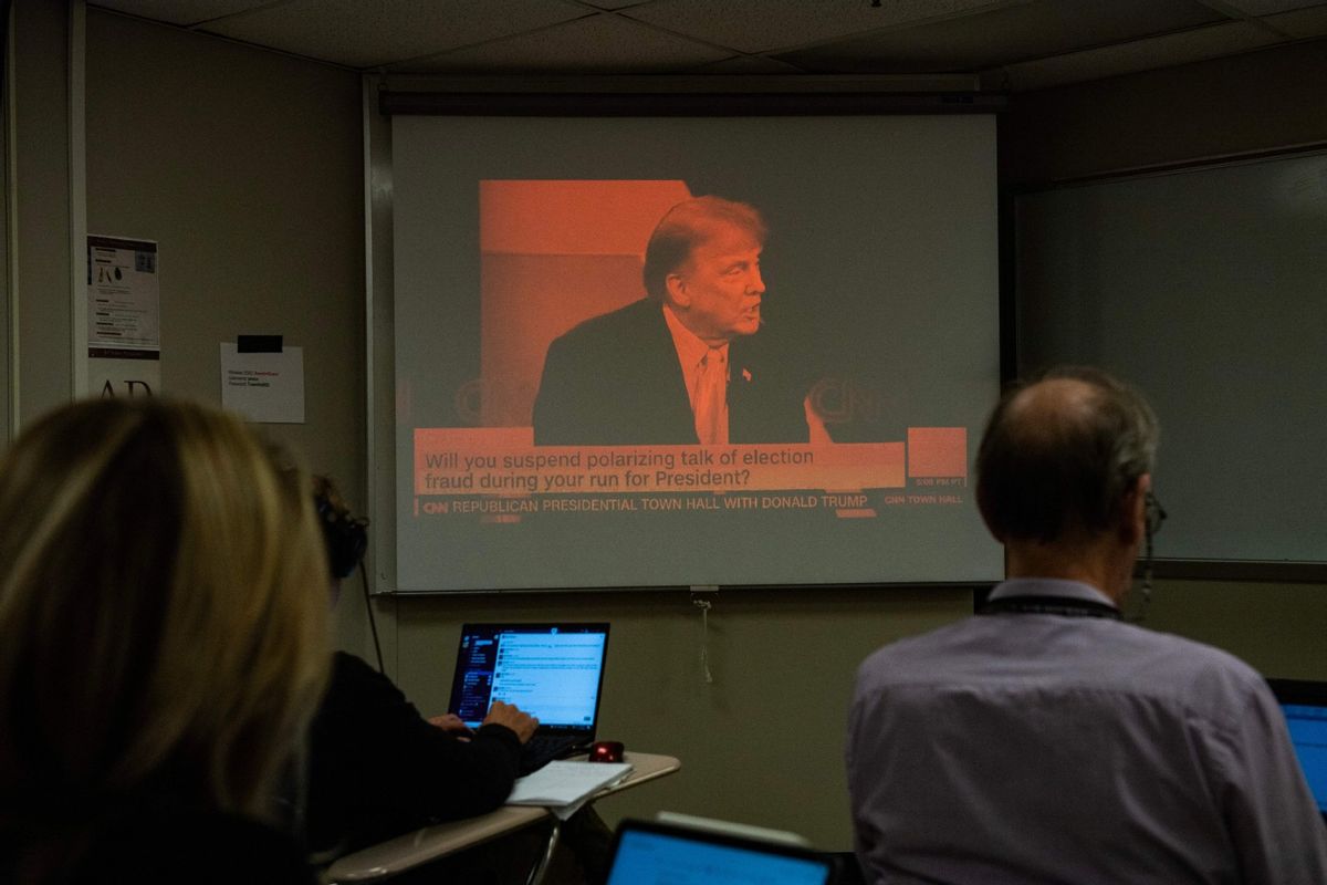 Reporters watch a CNN town hall with former US President and 2024 Presidential hopeful Donald Trump at St. Anselm College in Manchester, New Hampshire, on May 10, 2023.  (JOSEPH PREZIOSO/AFP via Getty Images)