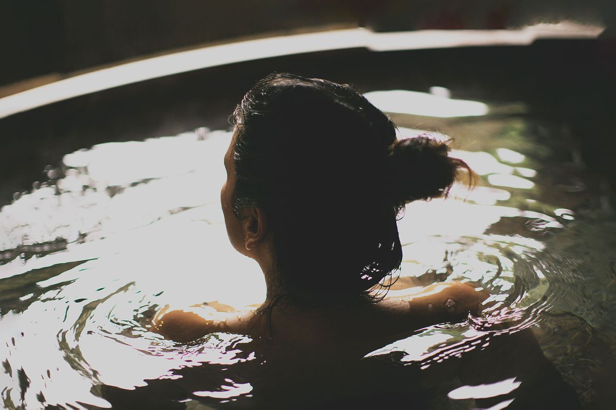 Woman bathing in a hot spring (Getty Images/Jesus Sierra)