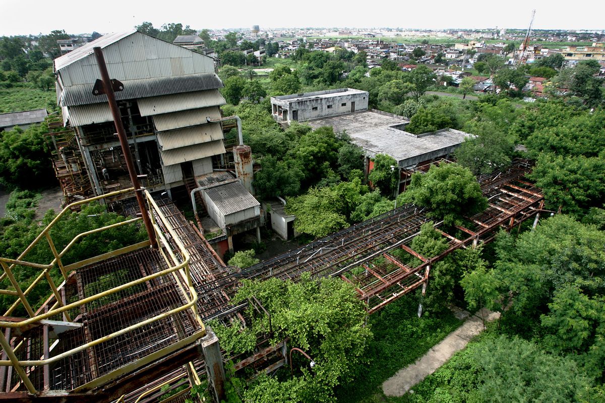 Rusting tanks inside the now derelict Union Carbide factory compound. These tanks used to store methyl isocyanide, the toxic chemical that leaked on December 23, 1984 killing at least 5,000 people in the following 72 hours and many thousands more subsequently. (Satish Bate/Hindustan Times via Getty Images)