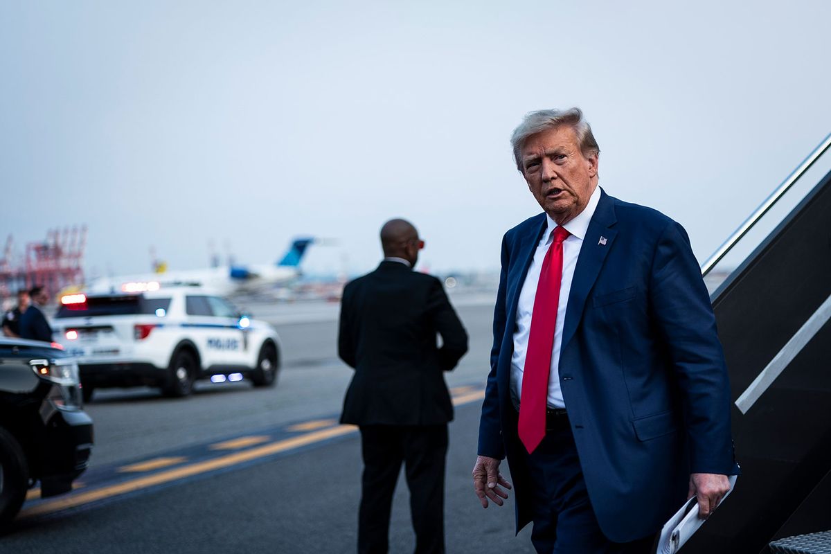 Former President Donald Trump disembarks his airplane, known as "Trump Force One," as he heads to speak an event at Trump National Golf Club Bedminster, in Newark, N.J. on Tuesday, June 13, 2023, following a first court appearance at Wilkie D. Ferguson Jr. U.S. Courthouse, in Miami, FL. (Jabin Botsford/The Washington Post via Getty Images)