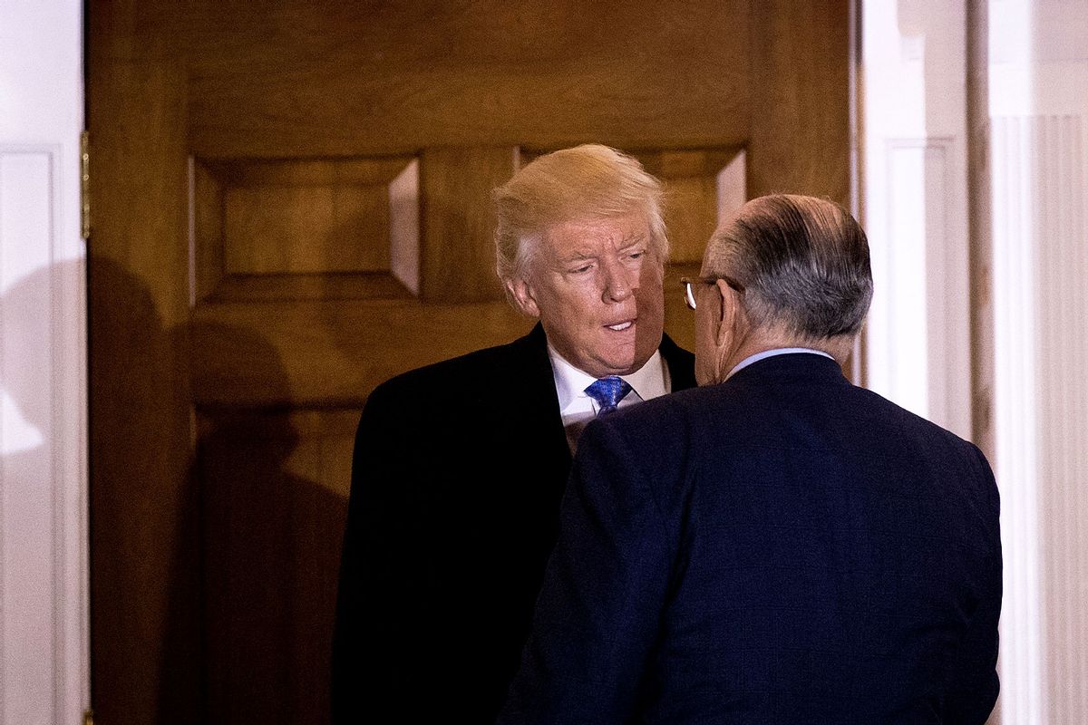 President-elect Donald Trump and former New York City mayor Rudy Giuliani talk to each other as they exit the clubhouse following their meeting at Trump International Golf Club, November 20, 2016 in Bedminster Township, New Jersey. (Drew Angerer/Getty Images)