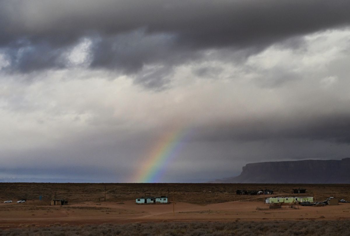 BITTER SPRINGS, ARIZONA - JANUARY 1: A rainbow is seen above homes in the Navajo Nation, on January 1, 2023 in Bitter Springs, Arizona. Reports say that nearly 40% of Navajo Nation is living without running water. Despite living near the Colorado River the Navajo Nation was left out of talks almost a hundred years ago when rule makers were drawing up the Colorado River Compact.(Photo by RJ Sangosti/MediaNews Group/The Denver Post via Getty Images)