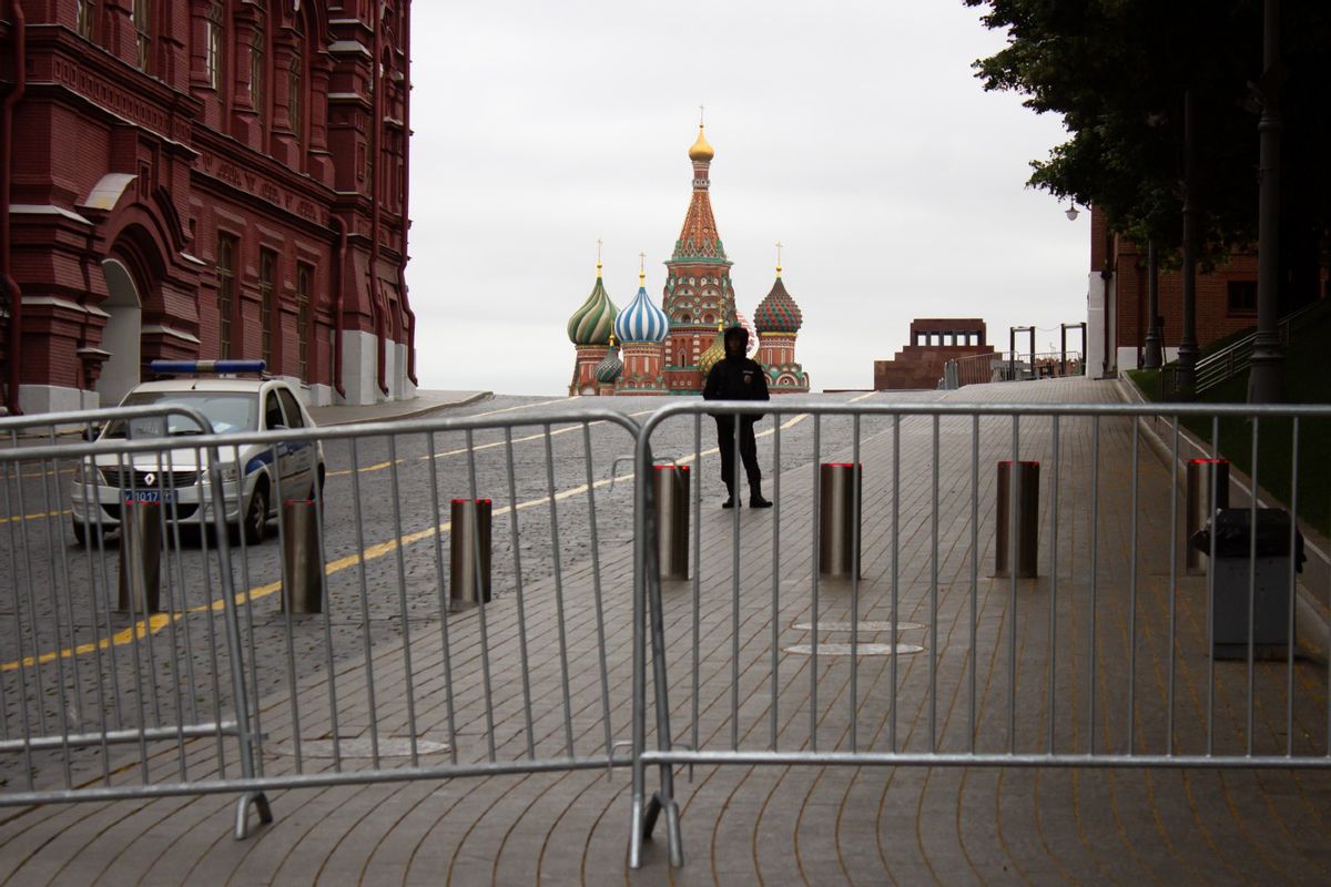 A policeman stands on guard at the closed Red Square in Moscow.  (Vlad Karkov/SOPA Images/LightRocket via Getty Images)