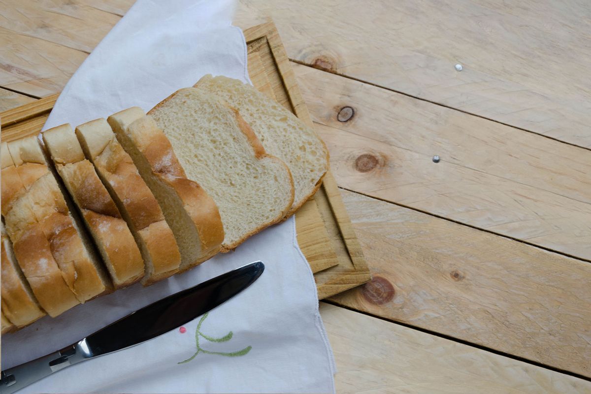 Loaf of sliced bread on a chopping board (Getty Images/Elizabeth Fernandez)