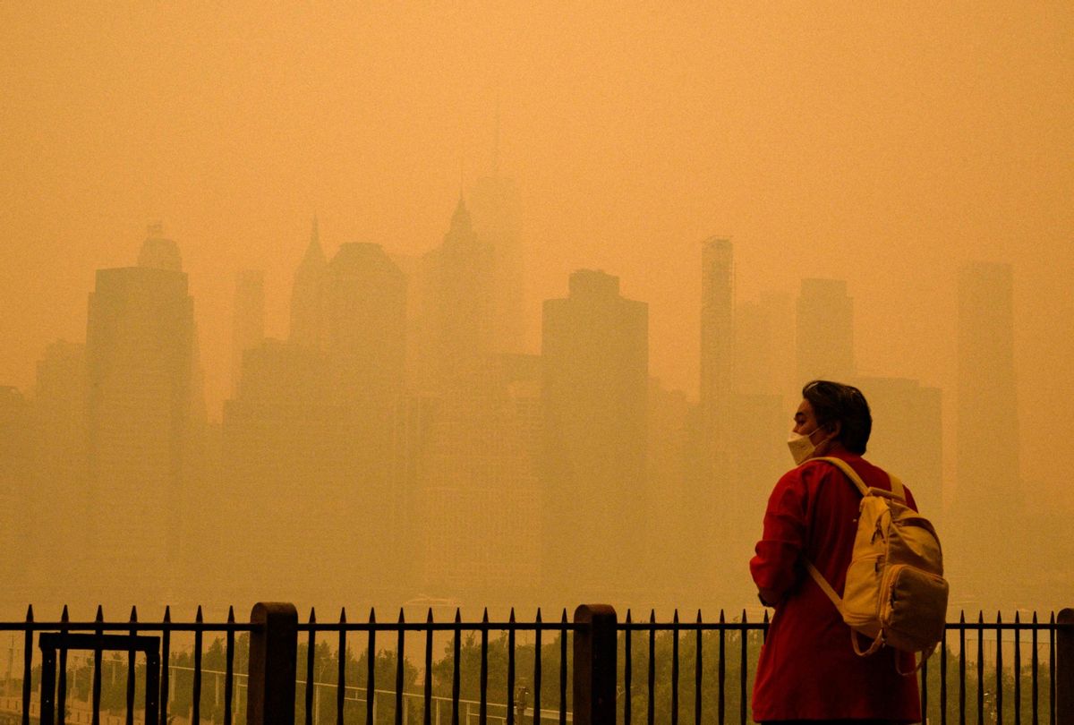 A person wears a face mask as smoke from wildfires in Canada cause hazy conditions in New York City on June 7, 2023.  (ANGELA WEISS/AFP via Getty Images)