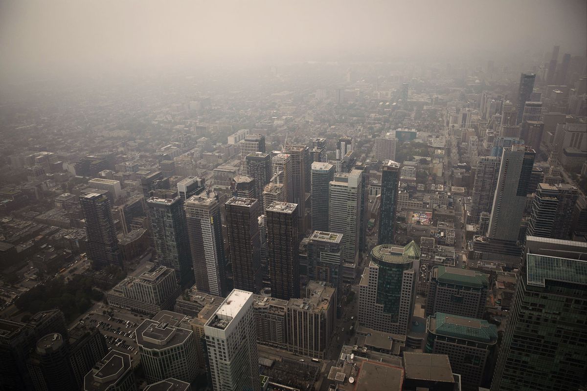 The Toronto skyline is seen covered by smoke from the CN Tower as wildfires in northeastern Ontario and Quebec continue to burn, in Toronto, Canada on June 28, 2023. (Arif Balkan/NurPhoto via Getty Images)