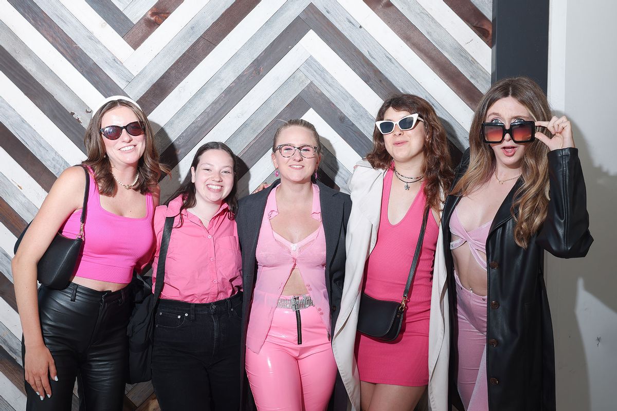 Izzy Ster, Adele Marchenko, Maya Gardner, Maddi Moran and Clare Larsen, left to right, are dressed as "Barbenheimer," a mix between "Barbie" and "Oppenheimer" outfits, outside a theater where the two movies are playing at AMC Century City on Friday, July 21, 2023 in Los Angeles, CA. (Dania Maxwell / Los Angeles Times via Getty Images)