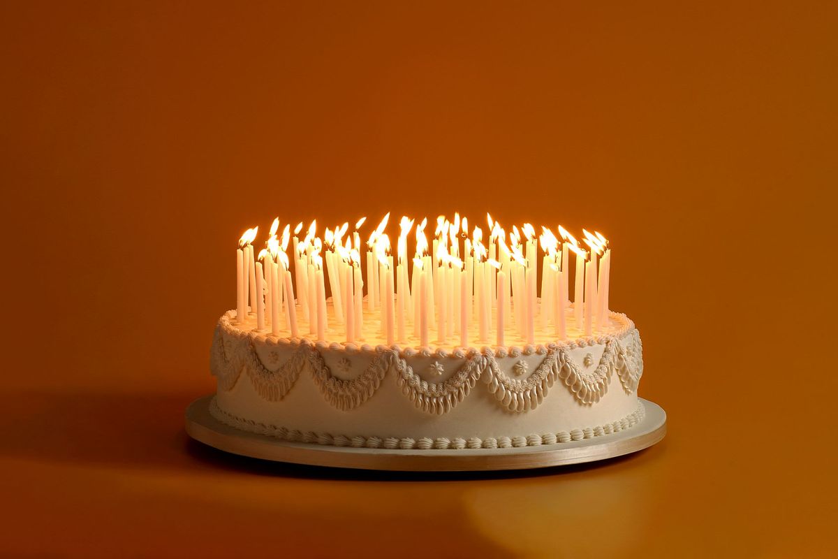 Birthday Cake With A Ton Of Candles (Getty Images/Ziviani)
