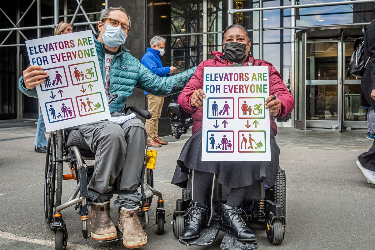 Participants holding signs demanding subway accessibility in Brooklyn, New York. (Erik McGregor/LightRocket via Getty Images)