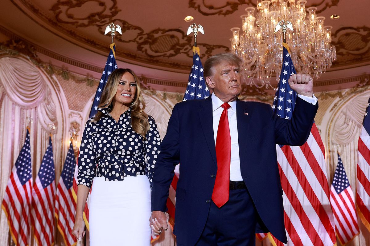 Former U.S. President Donald Trump and former first lady Melania Trump stand together during an event at his Mar-a-Lago home on November 15, 2022 in Palm Beach, Florida. (Joe Raedle/Getty Images)