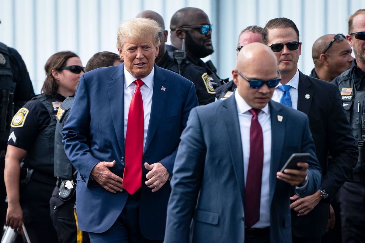 Former President Donald Trump and his aid Walt Nauta (right) arrive at an airport after Trump spoke at the Georgia Republican Party's state convention on Saturday, June 10, 2023 in Columbus, GA. (Jabin Botsford/The Washington Post via Getty Images)