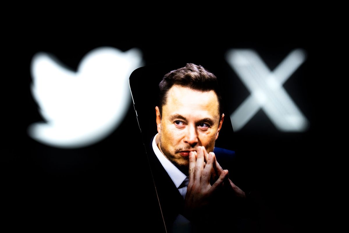 An effigy of Elon Musk is seen on a mobile device with the X and Twitter lgoso in the background (Photo by Jaap Arriens/NurPhoto via Getty Images)