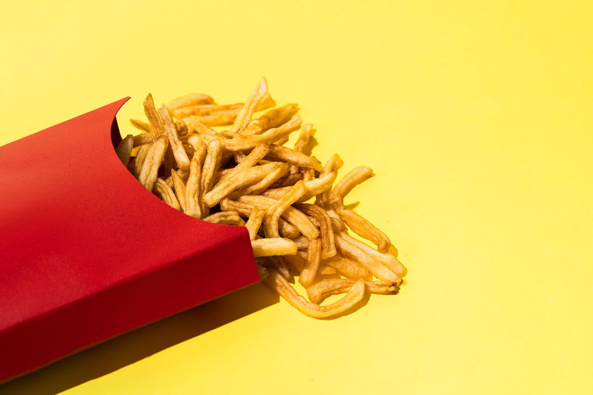 French Fries On Yellow Background (Getty Images/Javier Zayas Photography)