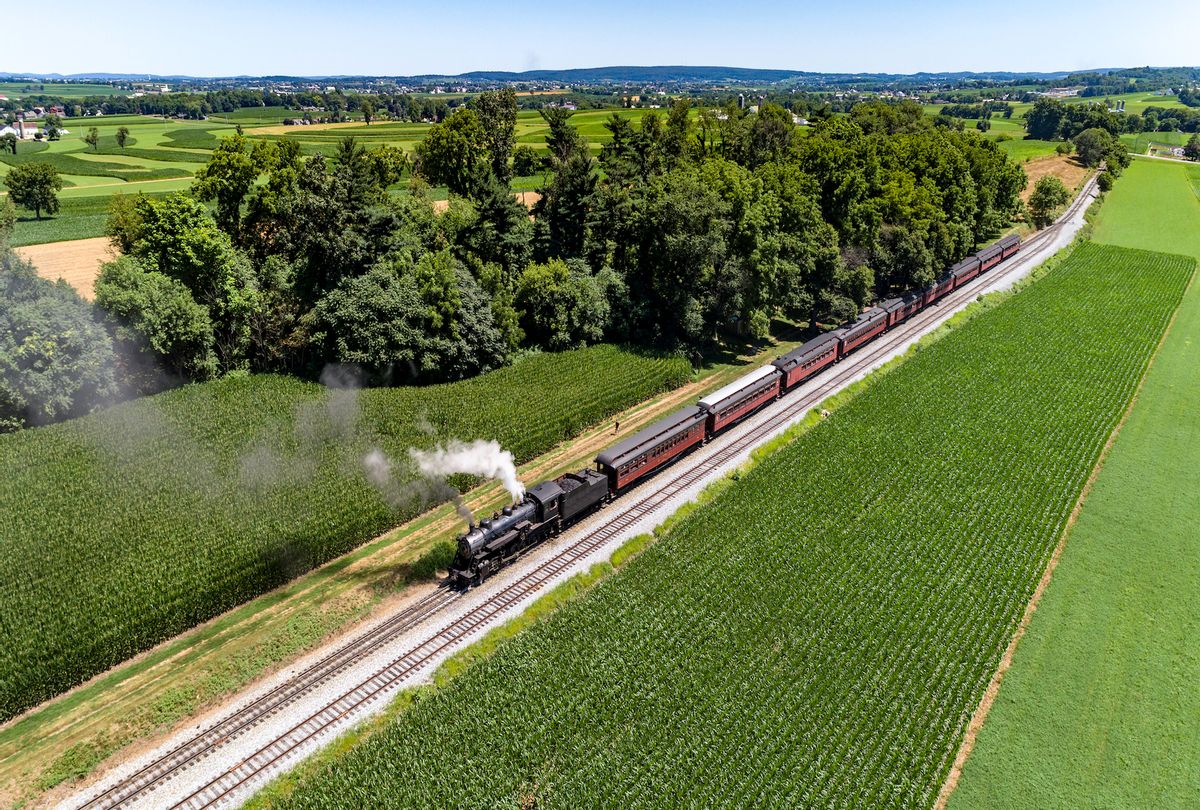Aerial View of a Steam Passenger Train Puffing Smoke in Amish Countryside on a Sunny Spring Day (Greg Kelton via Getty Images) (GettyImages )