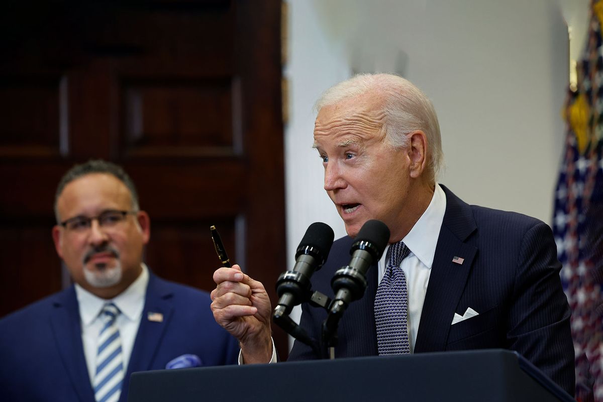 U.S. President Joe Biden is joined by Education Secretary Miguel Cardona (L) as he announces new actions to protect borrowers after the Supreme Court struck down his student loan forgiveness plan in the Roosevelt Room at the White House on June 30, 2023 in Washington, DC. (Chip Somodevilla/Getty Images)