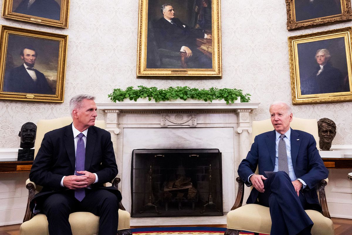 US House Speaker Kevin McCarthy (R-CA) (L) looks on as US President Joe Biden speaks during a meeting on the debt ceiling, in the Oval Office of the White House in Washington, DC, on May 22, 2023. (SAUL LOEB/AFP via Getty Images)