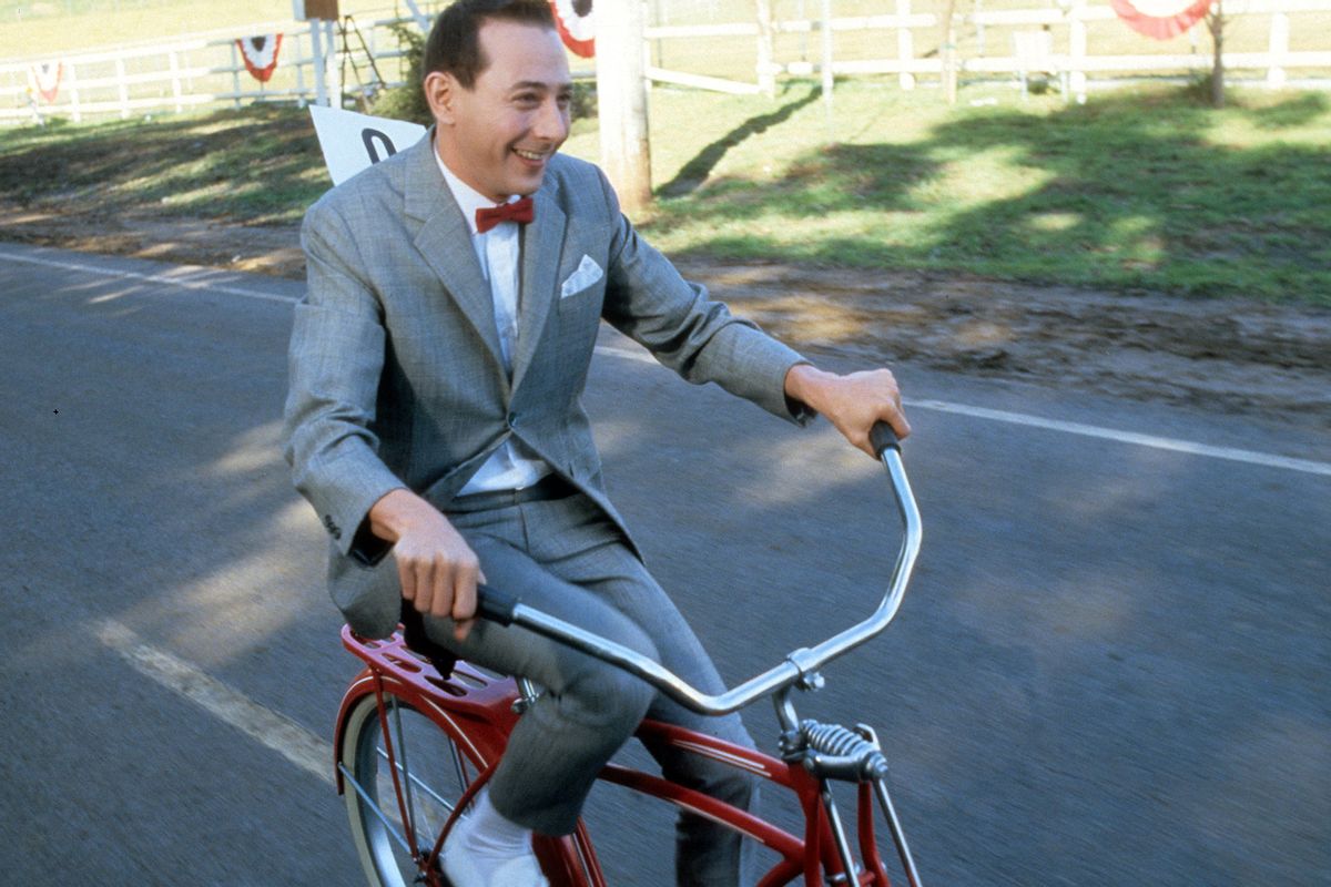 Paul Reubens rides a bike in a scene from the film 'Pee-Wee's Big Adventure', 1985. (Warner Brothers/Getty Images)